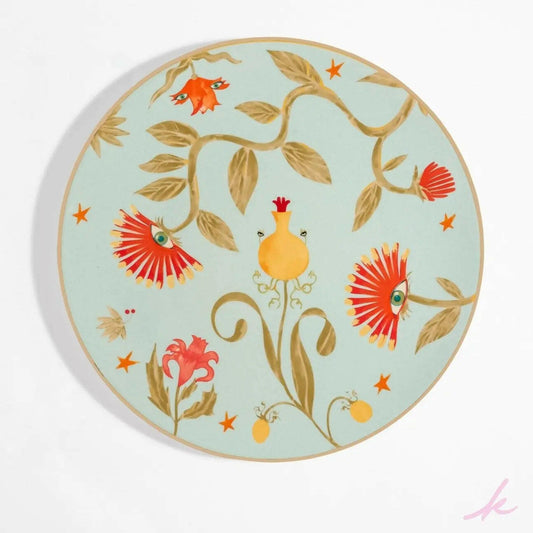 Peek-a-Bloom dinner plate with intricate floral designs and twinkling eyes, adding a touch of whimsy and warmth to every meal shared with loved ones.