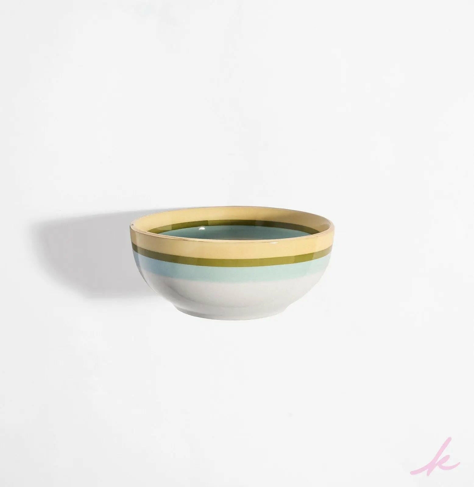 Peek-a-Bloom bowl featuring delicate blooms and twinkling eyes, perfect for serving soups or salads, and bringing joyful energy to your table setting.